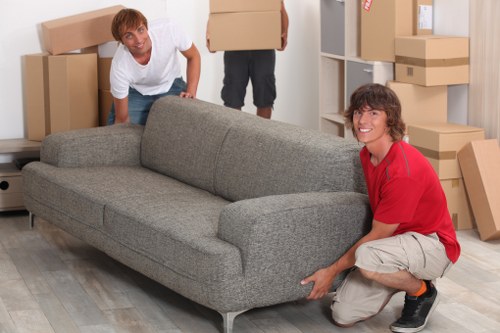 Packed boxes and furniture ready for a home removal service