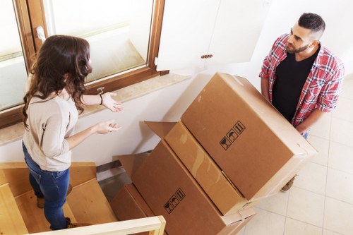 Packed boxes and furniture prepared for removal services in St Margarets