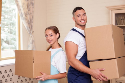 A local home move setup showing boxes, furniture protection, and organised packing