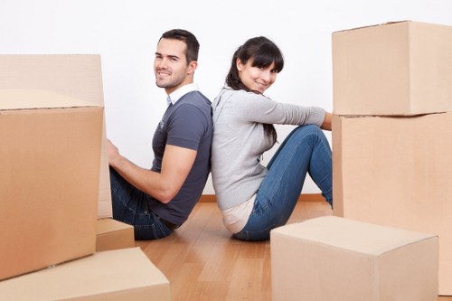 Packed household boxes and protected furniture ready for a local relocation