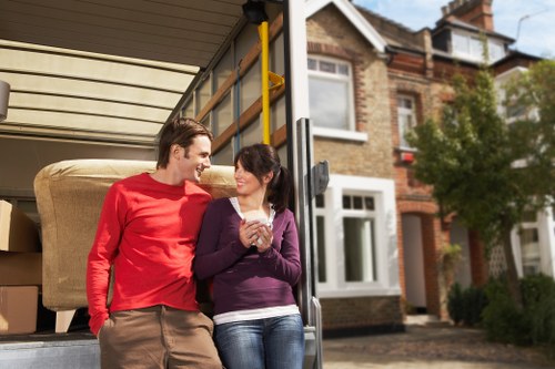 Removalists carrying furniture through a typical St Margarets property