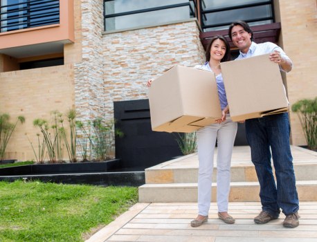 Moving team preparing a van for a home relocation