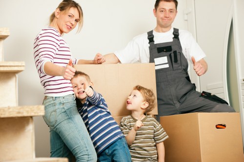 Local moving team handling boxes and access challenges in St Margarets